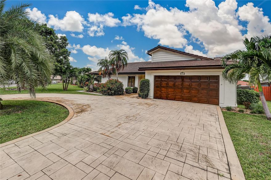 Over $70,000 in recent upgrades: brand new circular driveway, full exterior paint (house, roof, garage door, and fence), roof maintenance, and resurfaced pool tiles. Beautifully maintained 4-bedroom pool home in desirable Cypress Run. Open floor plan, and high ceilings. Priced at $795K, well below replacement cost given improvements. Features large vaulted smooth ceilings upon entering with tile and wood-like vinyl flooring throughout. Custom kitchen with Corian countertops for durability and repairability, an island for extra workspace for food prep, and S.S. appliances. Exterior features Clusia hedges for privacy, providing a striking visual element. Extended patio surrounding the pool with travertine tile! The roof was replaced in 2009.