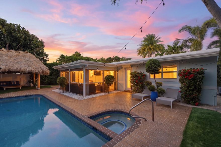 Welcome to your private slice of South Florida paradise. This beautifully updated 3-bedroom, 2-bath tropical pool home blends modern upgrades with laid-back coastal living. Step inside to discover a brand-new kitchen featuring sleek cabinetry, premium finishes, and a clean, contemporary design perfect for both everyday living and entertaining. The fully renovated bathrooms mirror that same elevated style, while new flooring flows seamlessly throughout the home, creating a fresh and cohesive feel. Impact windows provide peace of mind along with energy efficiency and abundant natural light. Outside, the property truly shines—your own resort-style backyard awaits with a sparkling heated pool and a charming tiki hut setting the stage for unforgettable gatherings or quiet evenings at home.