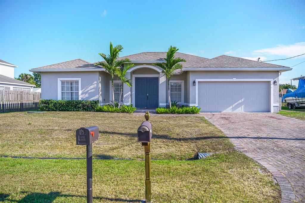 Photo of 1150 SW Sudder Avenue Ave, Port St Lucie, FL 34953 (MLS # R10720286)