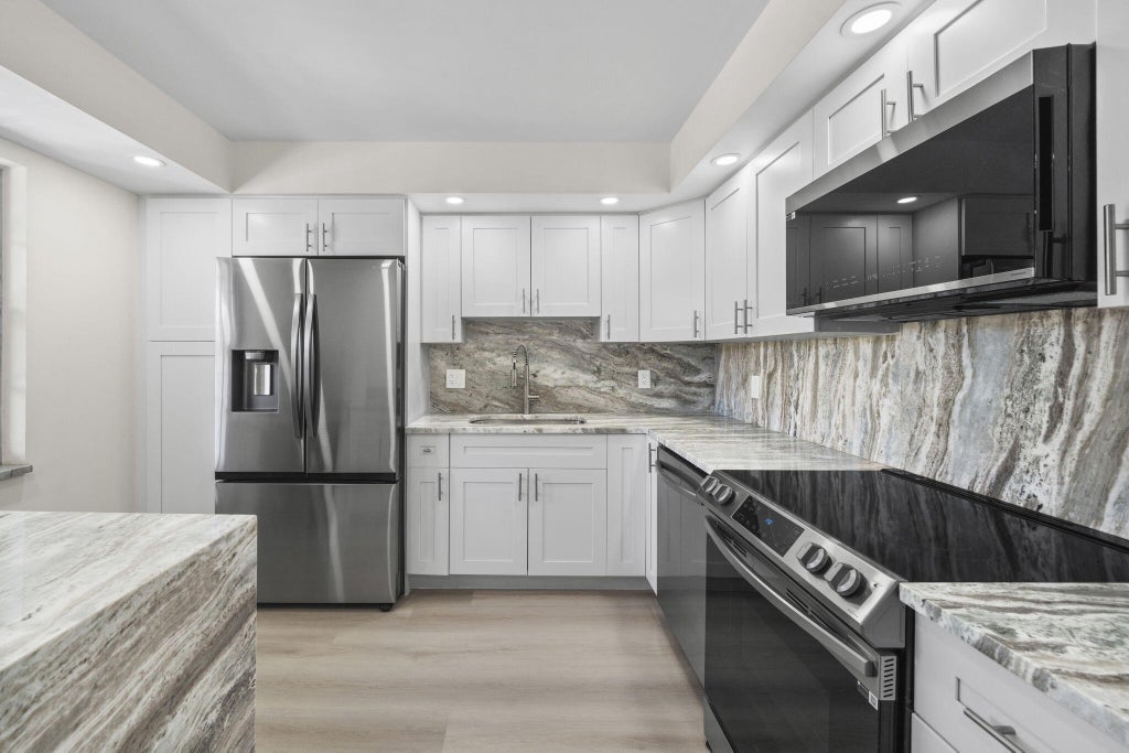 Photo of 4020 W PALM AIRE Drive #408, Pompano Beach, FL 33069 (MLS # B26069961)