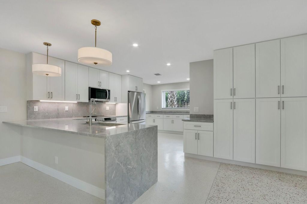 Photo of 732 Pelican Way, North Palm Beach, FL 33408 (MLS # R11039914)