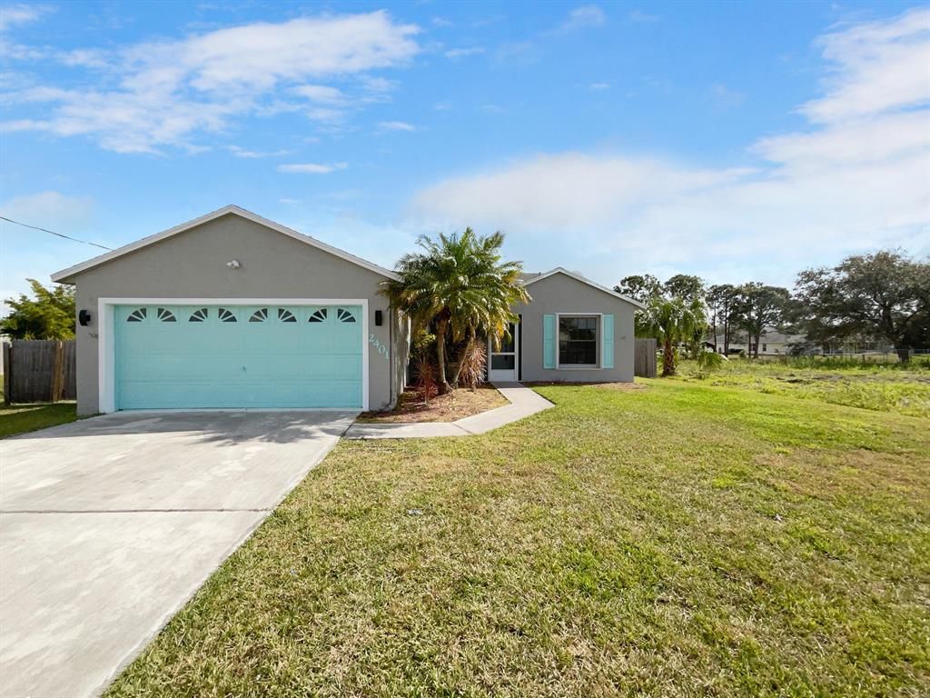 Photo of 2401 SW Halissee Street, Port St Lucie, FL 34953 (MLS # R10822465)