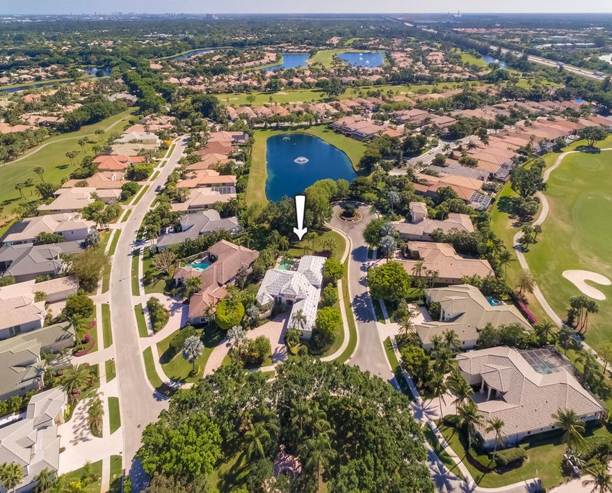 FALL in love....with the pride of Coquina Estates! This custom pool/spa home with a water view boasts a new roof, two new A/C units and a new pool pump. This rare gem sits on one of the largest corner lots in BallenIsles and the extended lanai is perfect for outdoor entertaining. Marble floors, soaring tray ceilings, and two en suite guest rooms are just a few additional reasons that this house is a MUST see. Take in the beauty of the private park across the street. Tighten the strings on your racquet - as this home requires the purchase of a tennis membership.