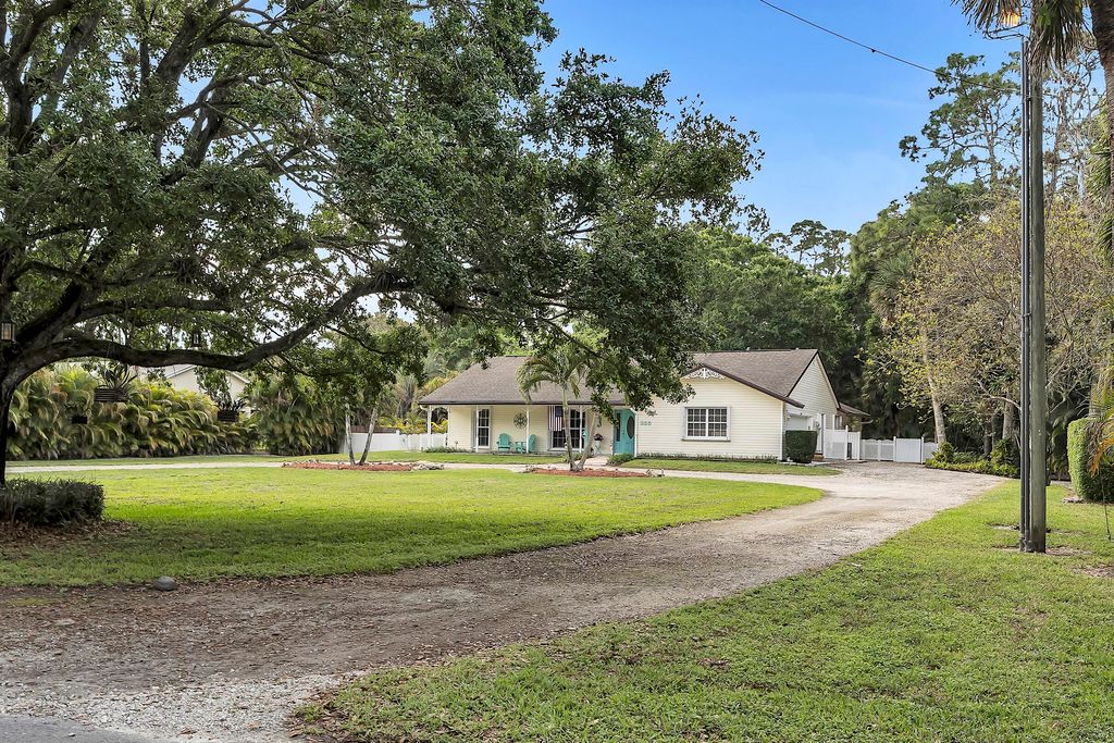 Photo of 355 86th Terrace S, West Palm Beach, FL 33411 (MLS # B26008324)