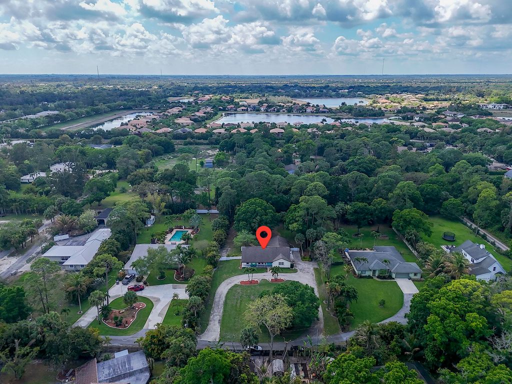 Photo of 355 S 86th Ter S, West Palm Beach, FL 33411 (MLS # B26008324)