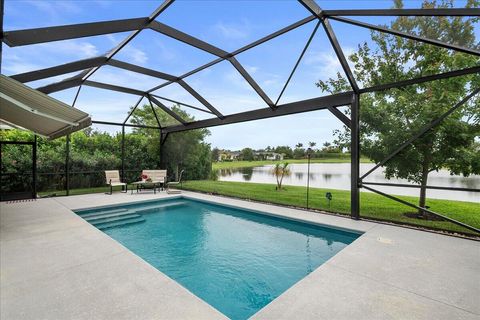 Photo of 786 SE Woodbine Road, Port Saint Lucie, FL 34984 (MLS # B26037333)