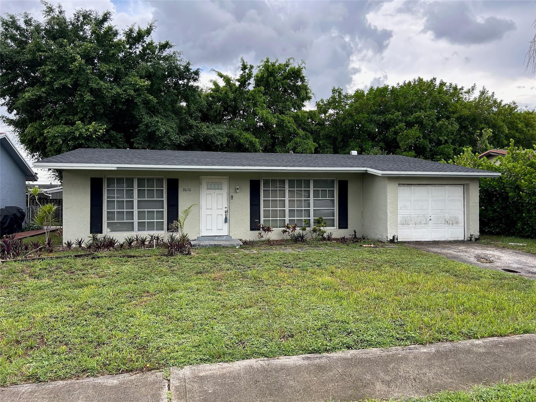 Beautifully renovated 3-bedroom, 2-bath single-family home for rent at 11610 NW 33rd St, Sunrise, FL 33323. Located on a quiet residential street just minutes from Sawgrass Mills Mall, I-75, and BB&T Center. This move-in ready home features a modern open-concept layout, stainless steel appliances, in-unit washer & dryer, and spacious bedrooms. Enjoy a fully fenced backyard with plenty of room for kids, pets, or outdoor entertaining. Central A/C, tile flooring throughout, and lots of natural light. Family-friendly neighborhood with excellent access to shopping, dining, schools, and parks. Easy to show and rapid approval process. Available now!