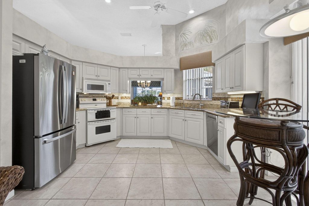 Photo of 216 Eagleton Lake Boulevard, Palm Beach Gardens, FL 33418 (MLS # B26020352)