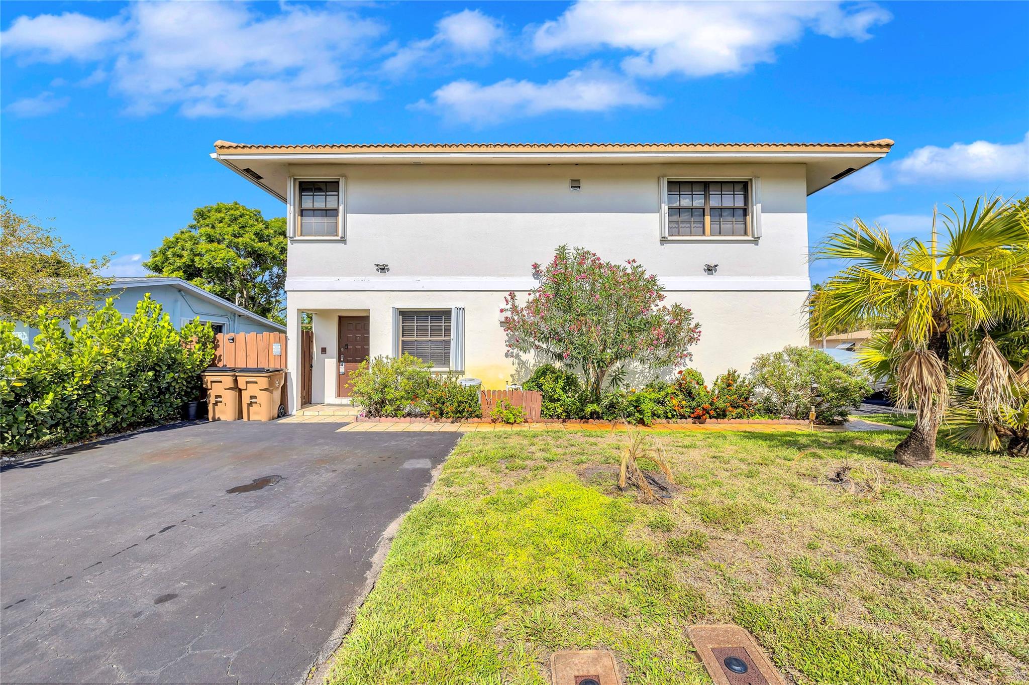 Beautifully updated home just minutes from Deerfield Beach. 2 driveways and 3 separate living units. Each unit has its own private entrance, kitchen, bedroom(s), bathroom (s), and A/C unit. The first floor was remodeled in 2020. The top floor was updated within the past 2 years. Whether you are looking to invest, live in one unit and rent the others or enjoy the whole house, this home delivers unmatched flexibility in a highly desirable location. Enjoy being close to top rated shopping, dining and beaches. 2/3 units are currently rented out. No HOA and hurricane protection. Photos are from downstairs unit. More photos to​​‌​​​​‌​‌​​​‌‌​​​‌‌‌​​‌​​‌‌​​​​ come.
