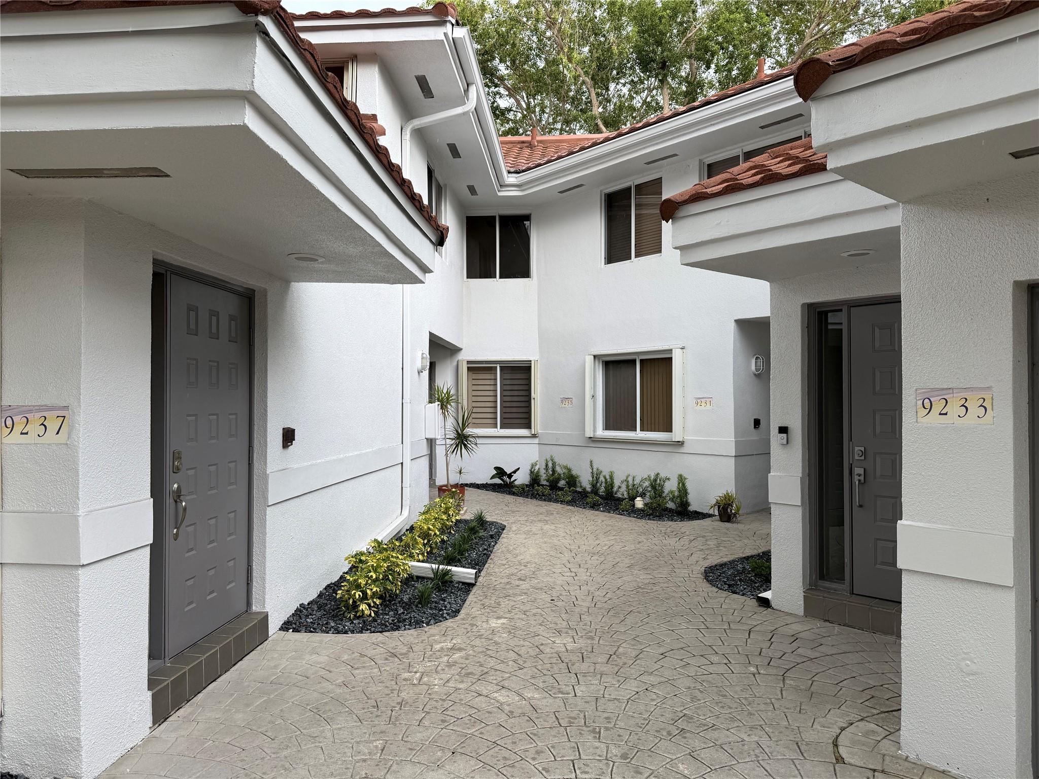 This 2-bedroom, 2-bath townhouse offers modern upgrades, vaulted ceilings up to 13 ft and serene canal views in a lush community. Built in 1988, this well-maintained neighborhood of 205 units features a pool, lounge area, and walking paths for pets. The home includes a ground-floor garage with stairs leading to the living area, a private balcony with Alexa-enabled fan and light, fresh paint, knockdown ceilings (no popcorn), wood floors, large tiles in the kitchen, granite counters, Samsung stainless appliances, and soft-close cabinets. Smart features include an Alexa-compatible garage opener. New A/C, updated PEX plumbing, and a new garage door opener providing comfort and efficiency.