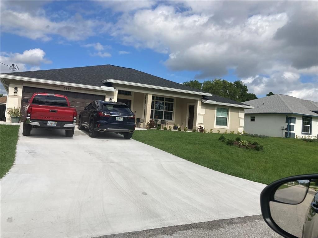 Photo of 1818 SW Davis St, Port St Lucie, FL 34953 (MLS # F10378285)