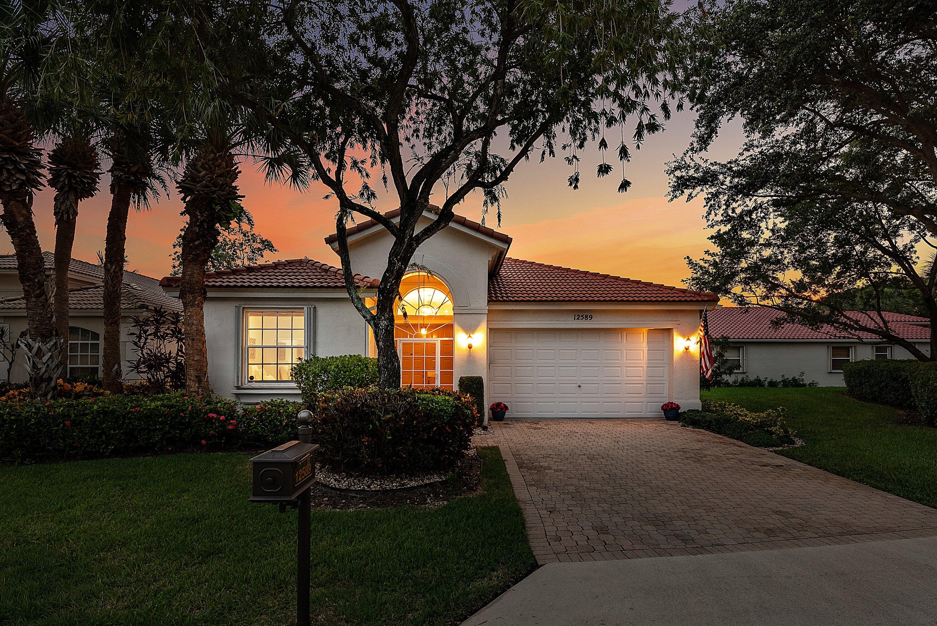 COME SEE THIS ELEGANT GRAND PALM MODEL w/ DRAMATIC DOUBLE DOOR ENTRY & 14 ft. SOARING CEILINGS. NEW ROOF 2022, NEW A/C 2024 & NEW W/H 2023! THE KITCHEN FEATURES WHITE CABINETRY (many extra cabinets & coffee station), GRANITE COUNTERTOPS w/ ROOM FOR 3 BARSTOOLS.THE PRIMARY BEDROOM IS EXTREMELY SPACIOUS w/ 2 LARGE WALK IN CLOSETS & VIEWS TO THE LAKE. RELAX IN THE IN FLORIDA ROOM WITH PRETTY LAKE VIEWS IN THE COOL A/C OR OPEN THE SLIDING GLASS DOORS TO ALLOW THE BREEZES TO BLOW THROUGH. CATCH RAYS OR GRILL OUT w/ FRIENDS ON THE OUTSIDE PATIO. CORAL LAKES HAS AN AWARD WINNING ACTIVE CLUBHOUSE w/ 600 SEAT THEATER FOR MOVIES, SHOWS & SEMINARS, CAFE, FITNESS CENTER, INDOOR POOL & RESORT POOL, PICKLEBALL & TENNIS, CRAFT ROOMS, MANY CLUBS & CARD GAMES TO JOIN, MANY SOCIAL OPPORTUNITIES!