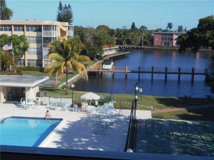 BEAUTIFUL WATERFRONT CONDO WITH AMAZING VIEWS OF THE WATER AND POOL. CAN BE RENTED RIGHT AWAY ! RENOVATED KITCHEN AND BATHROOM,  WALK IN CLOSET AND AN ADDITIONAL UTILITY CLOSET SPACE OFF THE LIVING ROOM. . COMMUNITY FEATURES 2 POOLS (ONE HEATED), GYM, SAUNA, POOL TABLES, BARB Q GRILLS, SECURITY CAMERAS, CLUBHOUSE, ETC. BASIC CABLE, WATER,WASTE AND FUMIGATION ARE INCLUDED IN THE MAINTENANCE. BOAT DOCK AVAILABLE FOR OWNERS ONLY.