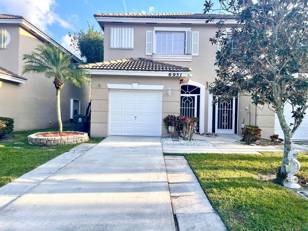 Photo of 6951 Thicket Trace Trce, Lake Worth Beach, FL 33467 (MLS # R10773179)