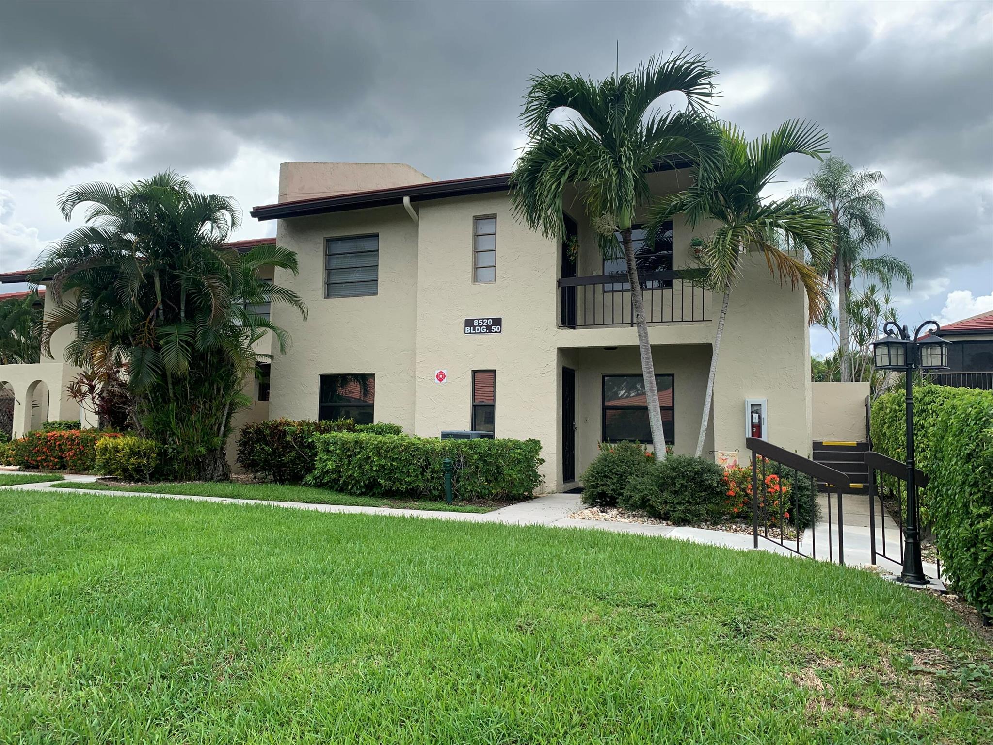 Awesome end unit with magnificent lake views from Florida Room. Upgrades throughout including built-in bar/wine cooler, electric fireplace. Newer baths; granite counter tops, natural wood cabinets, stainless steel appliances in kitchen. Tile floors except bedrooms. Huge master suite with large bath and three closets. Close to pools (2) and club house. Gated. Surrounded by golf course. Conveniently located near shopping and dining. Easy Turnpike access. Convenient to downtown Boca Raton and beaches.