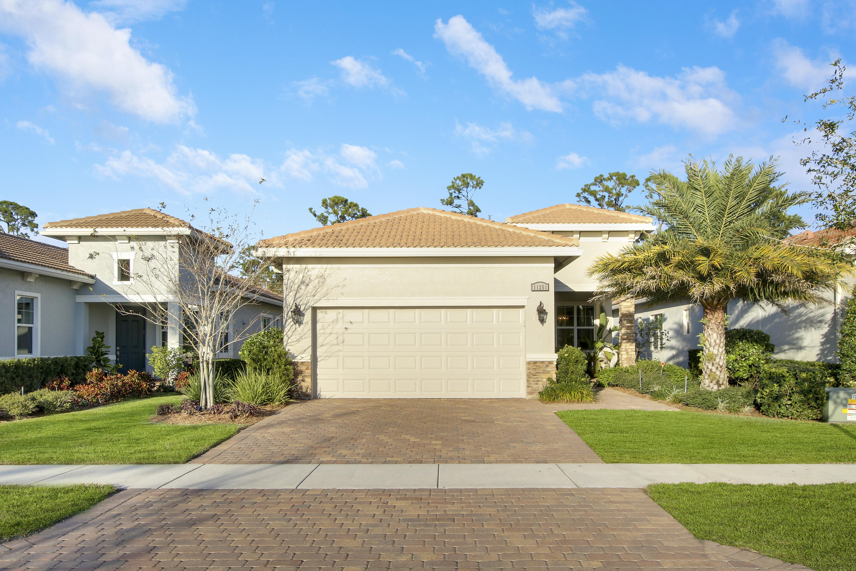 Beautiful 'Bella' plan with modern finishes in Verano! Enjoy the best of both worlds with a private back yard and lake views from the front of this home. This 2BR+Den/2BA/2CG home has been gently lived in and meticulously maintained. Large gray porcelain tile through the living areas and carpeted bedrooms. Eat-in kitchen with white cabinetry, quartz counters, SS appliances, snack bar and lake views from the breakfast nook. The master suite overlooks the back yard and has tray ceilings, dual closets as well as a relaxing ensuite with spacious walk-in shower and dual stone topped vanities. The den and guest bedroom are both conveniently located to the hall bath. Other special features include elegant light fixtures & fans, IMPACT GLASS windows & doors and a new washer & dryer in 2022!
