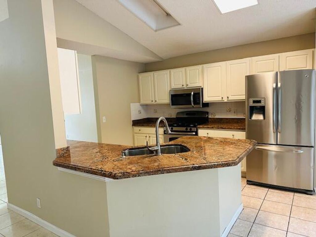 Photo of 459 Woodview Circle, Palm Beach Gardens, FL 33418 (MLS # R11028852)