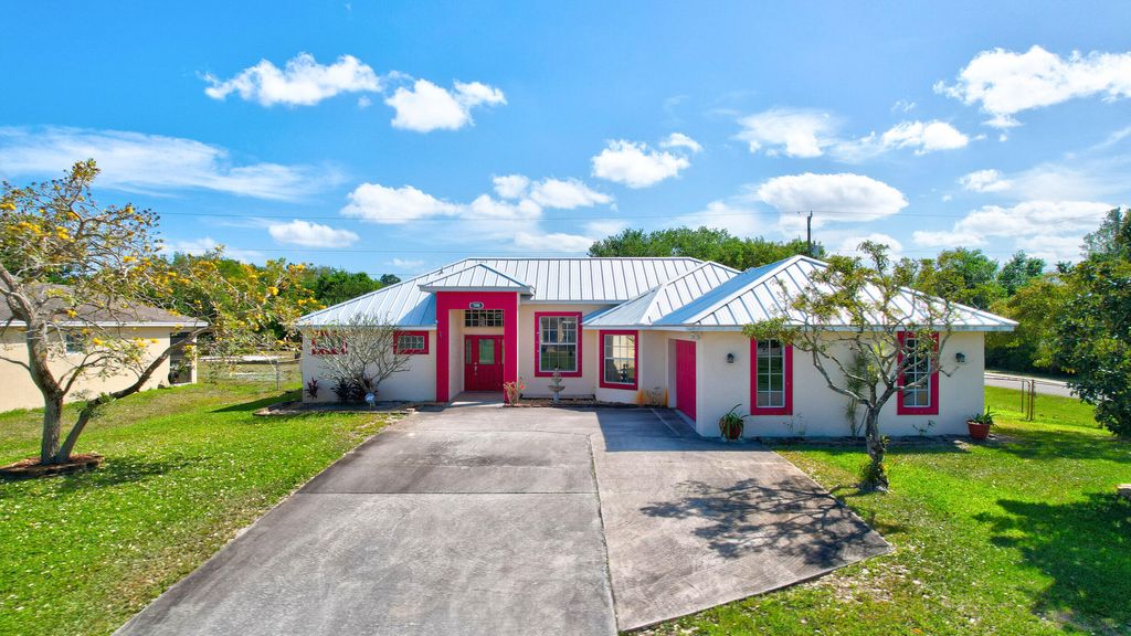 Photo of 590 SW Halkell Avenue, Port Saint Lucie, FL 34953 (MLS # R10970916)