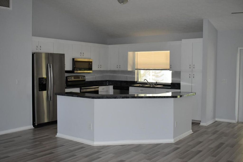 Photo of 1050 SE Euclid Lane, Port Saint Lucie, FL 34983 (MLS # R10943828)