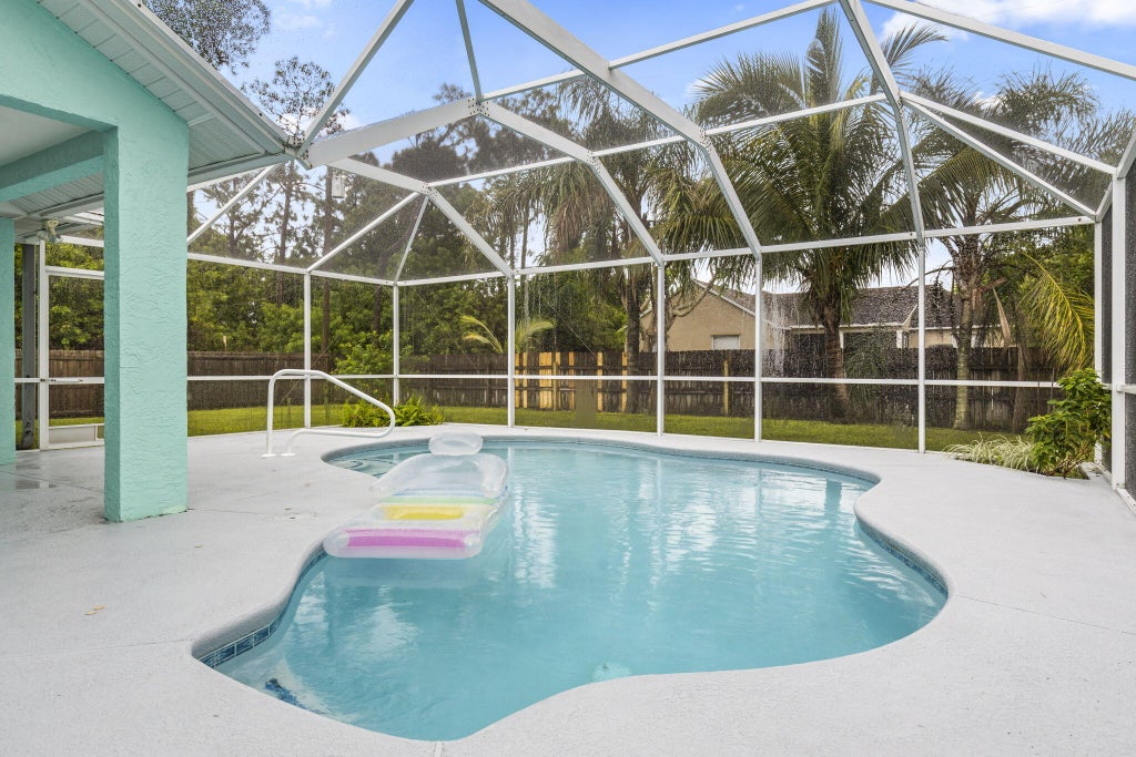 Photo of 402 SE Strait Avenue, Port Saint Lucie, FL 34983 (MLS # R10928591)