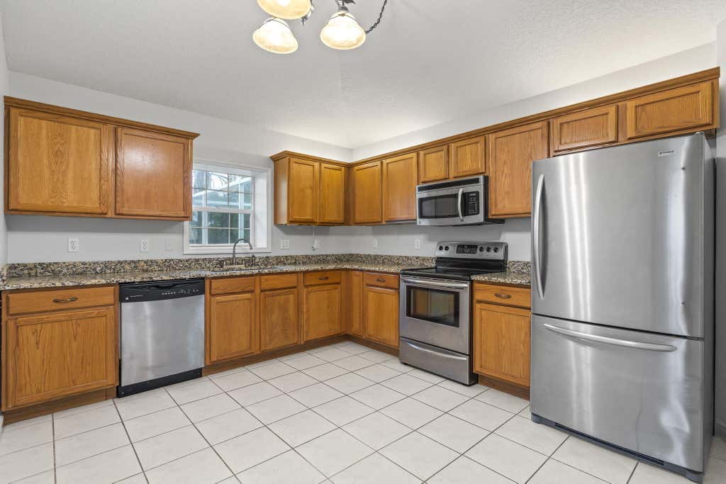 Photo of 402 SE Strait Avenue, Port Saint Lucie, FL 34983 (MLS # R10928591)