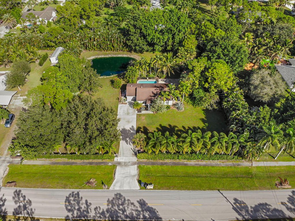 Photo of 15617 Temple Boulevard, The Acreage, FL 33470 (MLS # R10939716)