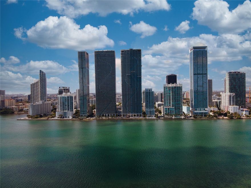 Experience luxury waterfront living at Aria Reserve South Tower, Miami's tallest residential bayfront twin towers. This stunning 1-bed + den, 2-bath residence offers approx. 1,200 sq. ft. with soaring 11-ft ceilings and unobstructed Biscayne Bay views. Floor-to-ceiling impact glass floods the open layout with natural light. Private vestibule with high-speed elevator ensures privacy. Enjoy 2+ acres of amenities: bayfront pools, spa, fitness center, tennis, pickleball, basketball, marina, co-working lounges, café, kids' areas, dog park, and 24-hr concierge & valet. 1 assigned covered parking with EV charging. Ideally located in Edgewater, minutes from Wynwood, Design District, Downtown & Miami Beach. A rare opportunity at one of Miami's most iconic new towers.