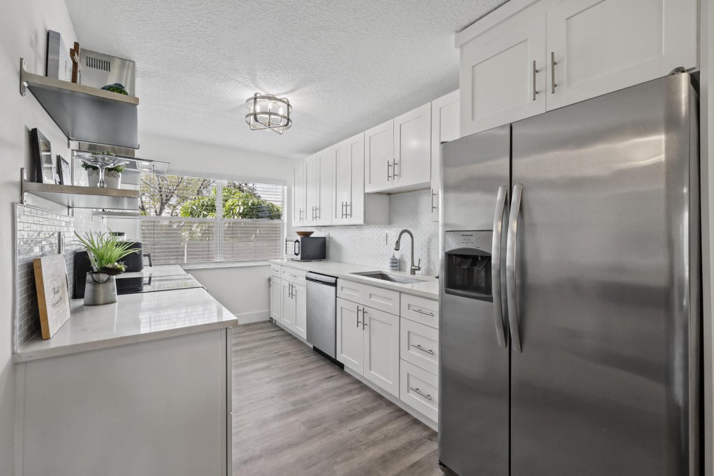 Photo of 8105 NW 61ST Street #A203, Tamarac, FL 33321 (MLS # B26085484)
