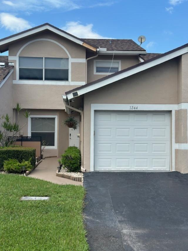 GREAT OPPORTUNITY TO MOVE INTO THIS UPGRADED 2 BEDROOM 2 AND A HALF BATH TOWNHOME WITH A ONE CAR ATTACHED GARAGE. FULL SIZE WASHER AND DRYER IN THE GARAGE. KITCHEN FEATURES SS APPLIANCES, BUILT IN MICROWAVE, GRANITE KITCHEN COUNTERTOPS, AND DARK WOOD KITCHEN COUNTERTOPS. MULTIPLE CEILING FANS THROUGHOUT. EXTENDED SCREENED IN PATIO WITH A SPECTACULAR LAKEVIEW WITH PATIO FURNITURE INCLUDED. FIRST MONTH AND ONE MONTH SECURITY FOR MOVE IN FUNDS WITH GOOD CREDIT AND GOOD INCOME. AMENITIES INCLUDE CLUBHOUSE, POOL., SPA AND TENNIS COURTS. GREAT LOCATION EASY ACCESS TO BOTH I-95 AND THE TURNPIKE. 15-20 MINUTES TO THE BEACH.