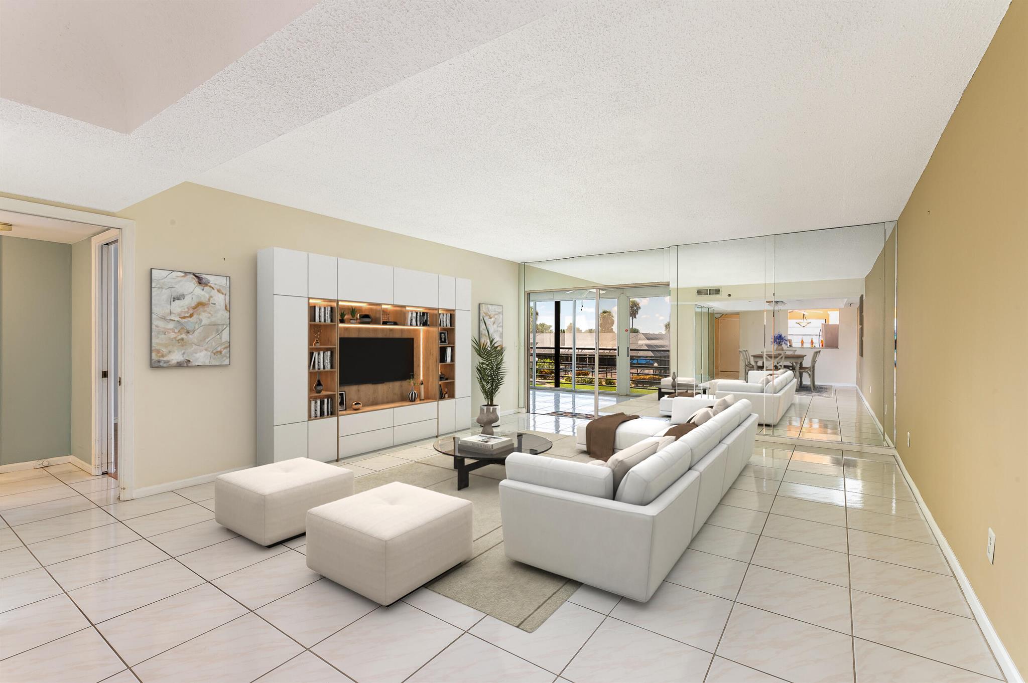 Current photos do not reflect the freshly painted interior and new baseboards, now updated in soft, neutral tones. Patios of Boca Barwood, a premier active adult community, where this beautifully updated 2-bed, 2-bath residence offers tranquil views Features an updated kitchen and bathrooms, a new roof, A/C, and newer appliances--providing ease and peace of mind. Virtual staging highlights the potential to make this inviting space your own. Residents enjoy a wealth of amenities including a clubhouse, a fitness center, card room, 2 pools, spa, bocce ball, tennis courts, and BBQ area. The community has 2 outdoor Jacuzzis, a shaded seating areas with umbrellas, and meticulously maintained grounds perfect for relaxation. Completed reserve study, structural certification budgets available.