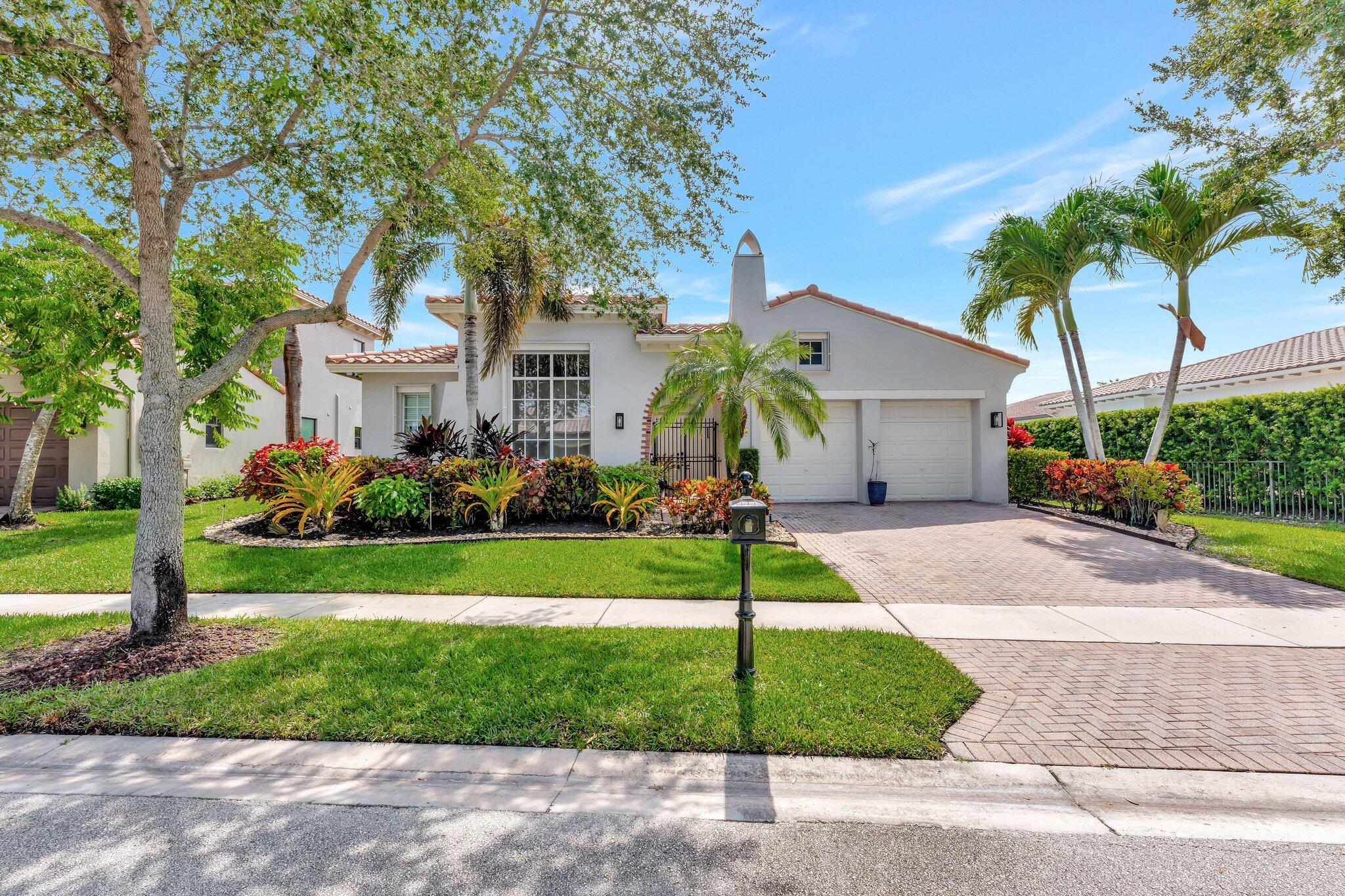 COMPETITIVELY PRICED single-story home located within the prestigious gates of HERON BAY. A gated courtyard welcomes you to this meticulously maintained home. Contemporary and traditional touches are carefully integrated to provide the comfort and charm of a seamlessly blended indoor, outdoor lifestyle. Designed to be functional, the kitchen flows into the family room and breakfast nook while it showcases formal living and dining areas. Storm shutters and a security system offer safety and peace of mind. The 2 car garage has been updated with epoxy floors and custom built storage. A sparkling pool, improved with all the bells and whistles, is the centerpiece of the manicured backyard retreat with tropical fruit trees framing the perimeter. Enjoy the fine amenities offered at the HERON BAY