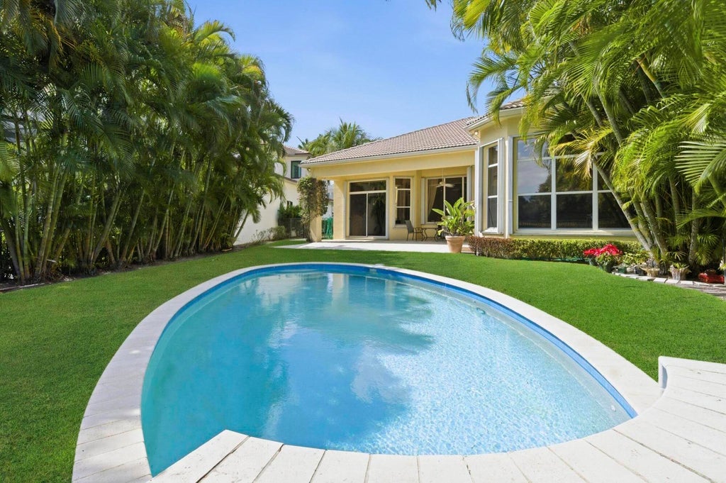 Photo of 401 VIA PLACITA, Palm Beach Gardens, FL 33418 (MLS # B26078009)