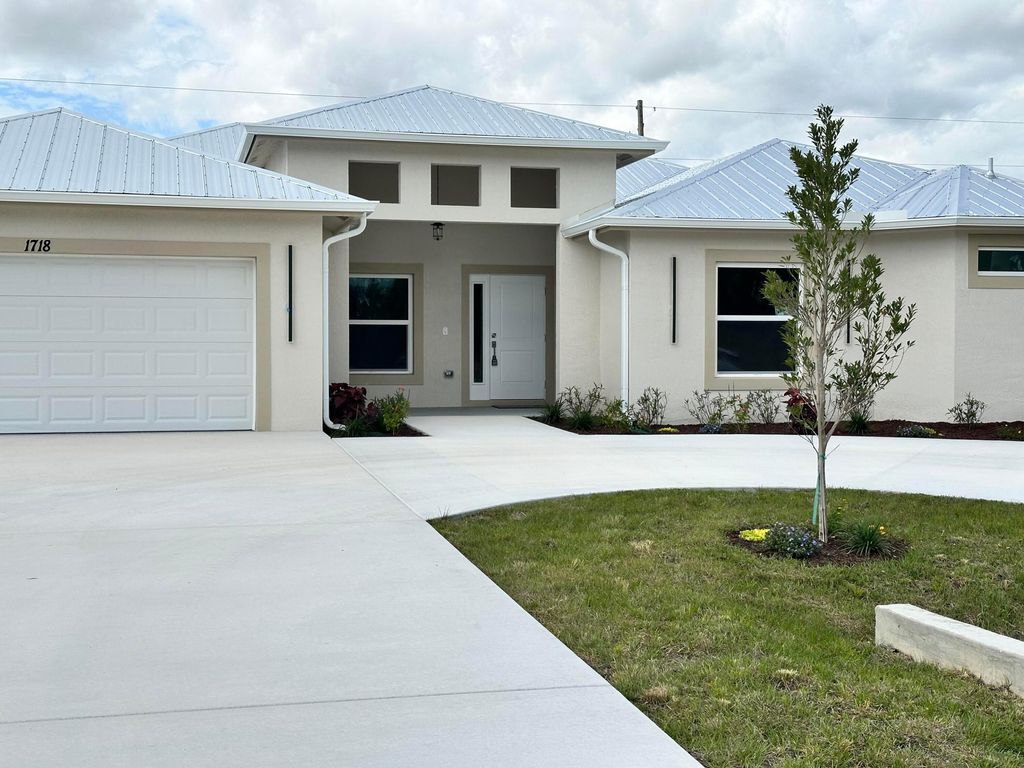 Photo of 1718 SW California Boulevard, Port Saint Lucie, FL 34953 (MLS # R11064991)