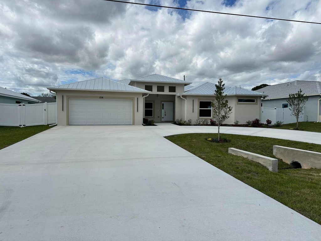 Photo of 1718 SW California Boulevard, Port Saint Lucie, FL 34953 (MLS # R11064991)