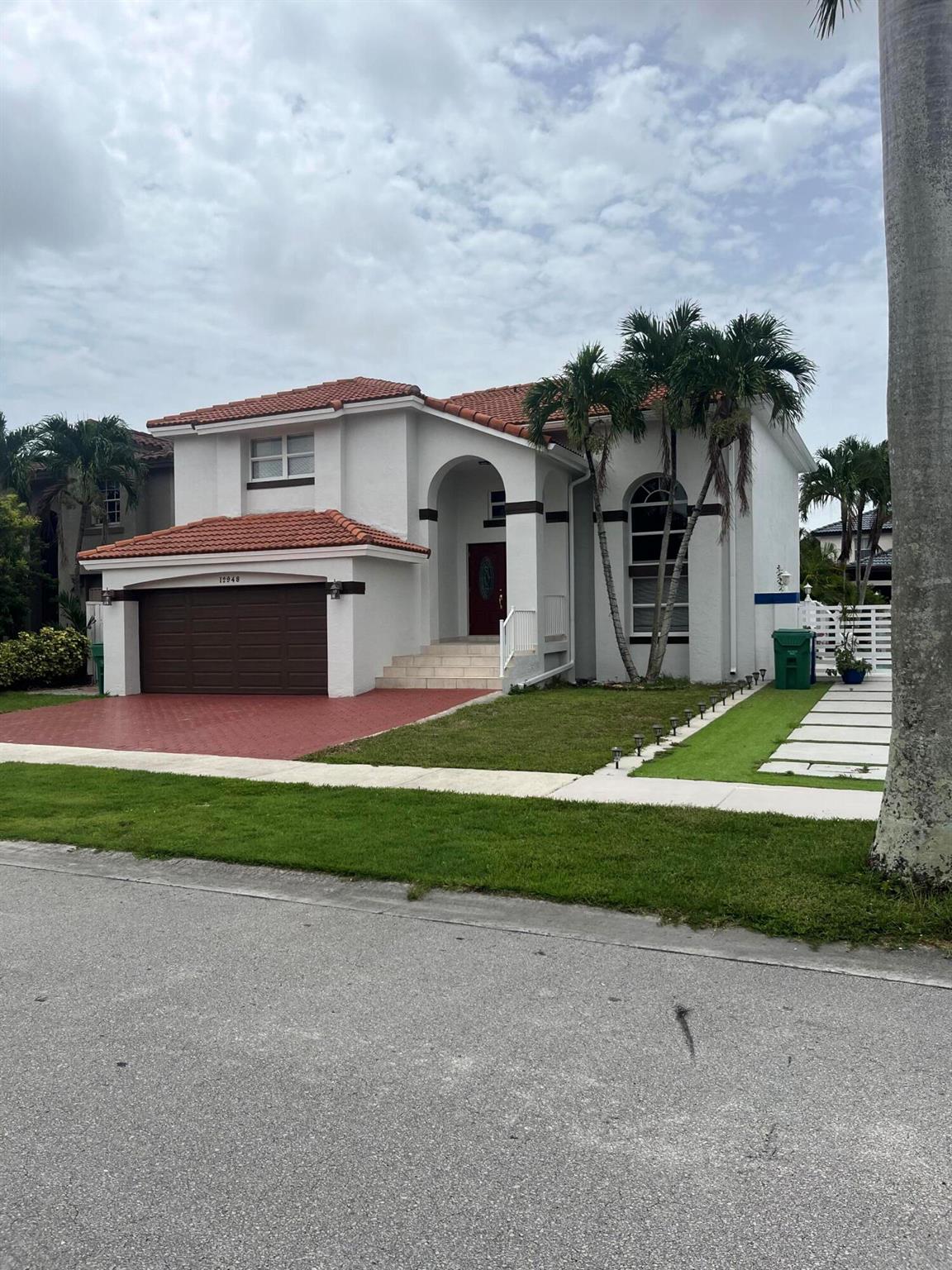 AVAILABLE NOW! This extraordinary spacious over 2300 square feet 2 story 3 bedrooms 2.5 bath home in the beautiful Tamiami area. this prime location provides easy access to all of Miami with highways, shopping, airport only minutes away. Home features all impact windows & doors throughout. Beautiful hardwood stairs and upper level and newer elegant tile floors in main level. Elegant spacious kitchen with wood cabinets, granite counters, stainless steel appliances makes cooking and entertaining a breeze. Bathrooms recently remodeled with new tile floors and fixtures. Brand new Washer/Dryer. Step outside to your spacious private fully fenced backyard to complete your Florida Oasis.