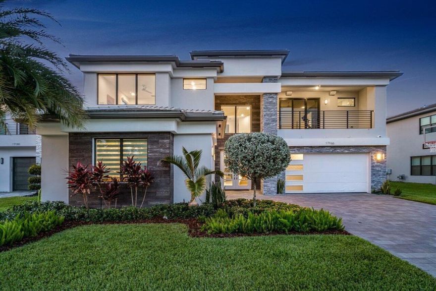 Coveted Sumatra Premium in Lotus! This home showcases beautiful white 32'' x 32'' porcelain floors in the main areas, as well as engineered wood flooring. Beautiful custom 8' solid core doors and high ceilings create an airy open feeling. The home has been professionally prewired for everything media and security related. The HVAC systems are comprised of THREE, top tier Carrier units. The kitchen is a chef's dream, equipped with top-of-the-line appliances including a sleek ..counter depth Sub-Zero refrigerator and a state-of-the-art natural gas cooking range. The master bedroom and the office are conveniently located on the main level of the home, with 4 additional bedrooms, a media room, and loft located on the second level.

Step outside to the lush backyard, complete with an extra-large resort-style custom salt pool and spa, a wonderful, covered summer kitchen, specialty artificial turf and professional landscape lighting.