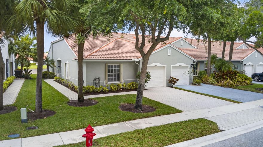 Rarely available lakefront, 3-bedroom, 2-bath end unit in desirable Venetian Isles, a premier 55+ community. Natural light fills the space of this split floorplan villa and a screened lanai offers tranquil lake views. A large kitchen, dining area and pantry are the heart of this villa. The 3rd bedroom offers a great option for an additional bedroom or office. Enjoy resort-style living with a newly renovated clubhouse featuring a fitness center, pickleball and tennis courts, card rooms, a café and full-bar, plus a full social calendar that will keep you busy all year. Relax at the resort-style pool or exercise in the resistance pool all just moments from your door. Whether seasonal or year-round, this is low-maintenance living in one of the best gated communities in Boynton Beach.