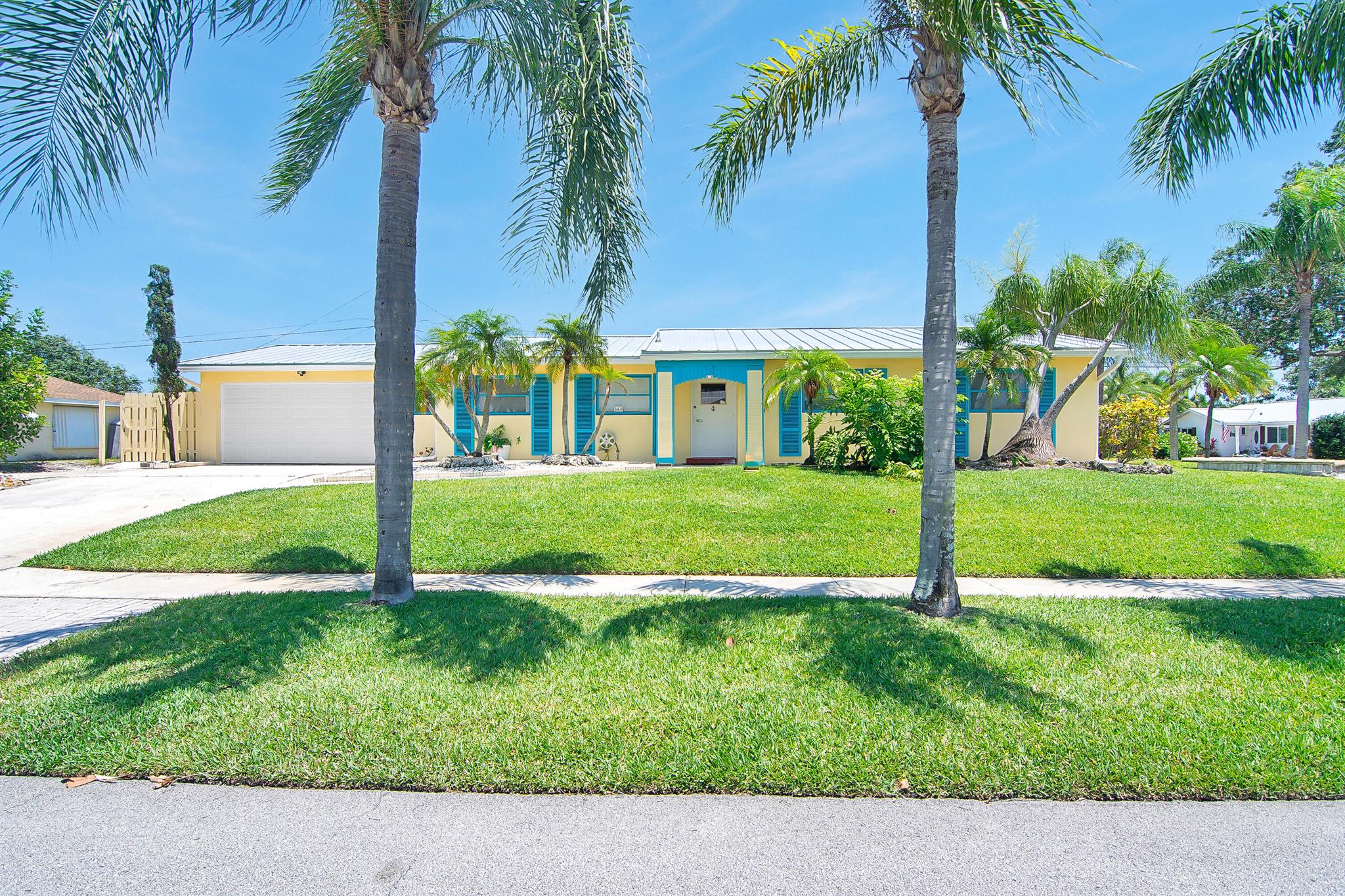 Welcome to this home situated in the heart of Tequesta. This 2 bedroom/2 bath home features a roof installed in 2024, AC in 2024, exterior painted in 2024 and interior freshly painted in 2025. Nestled on a high and dry, corner lot this home has a fenced yard and a private pool. The 2 car garage has a new beltless garage door,2025, and a rear door large enough for a boat to be parked in the additional space in the rear of the home. The spacious interior is all tile, no carpet and the two bedroom suited both have bathrooms ensuite. Located in highly desirable Tequesta this home is waiting for you to update this home and make it yours. Located close to the Loxahatchee River and several beaches, along with vibrant local amenities and restaurants.