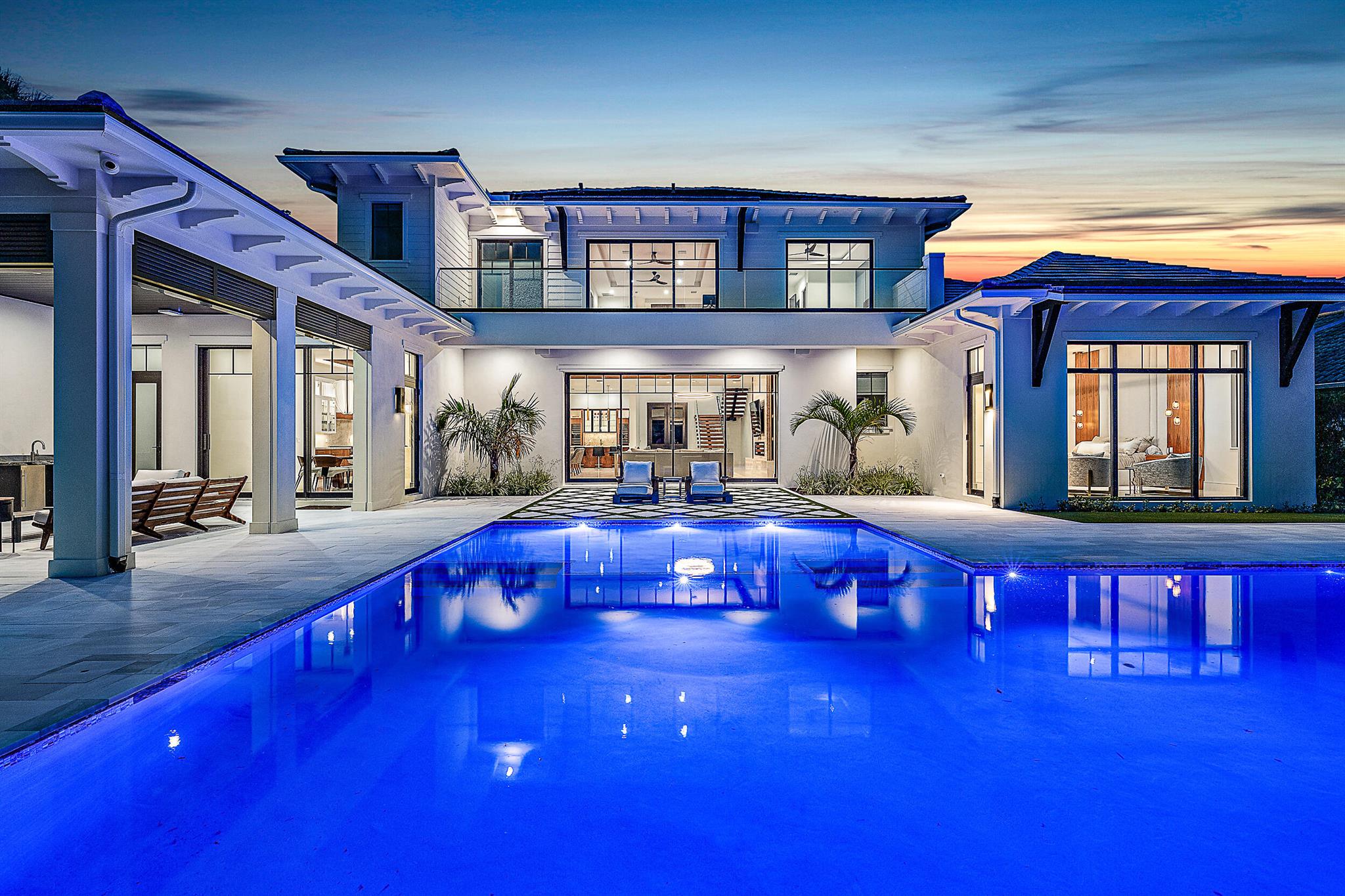Newly completed waterfront estate home! This stunning Hasey built home has everything your heart could desire, from 5 richly appointed en-suite bedrooms to a light filled chef's kitchen that opens to the living areas & features not only an oversized prep island with countertop seating & a separate bar, but a spacious butler's pantry as well. With the expansive summer kitchen & resort style pool just off the kitchen & living areas, this is the perfect home for entertaining. The living area features a floor-to-ceiling stone fireplace with custom built-ins. Featuring opulent finishes, the primary suite offers 2 massive walk-in closets, a luxurious bathroom with separate water closets, steam shower, soaking tub, a breakfast bar, & sitting area overlooking the water.