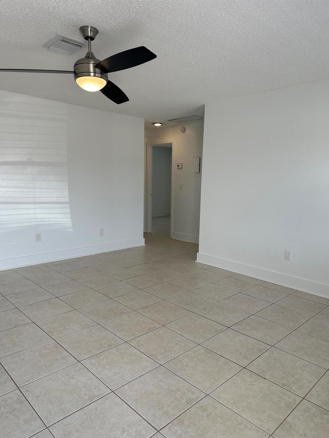 Charming 3-bedroom, 1-bath duplex unit in Lake Worth! Freshly painted and ready for move-in, this spacious home features an open living area, tile flooring, and a bright kitchen. Washer/dryer hookup available for your convenience. Great location near shops, dining, and beaches. Don't miss this one!