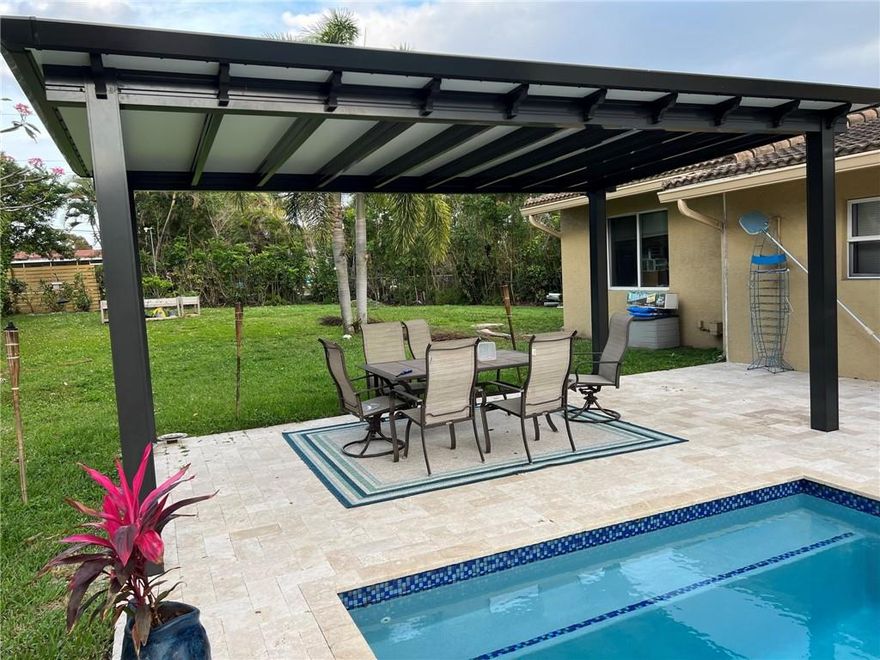 *Professional Photos Coming Soon* Right in the middle of East Boca Raton this 5-bedroom home features upgrades and loving touches. Brand new AC unit 2022.  Step into the master suite and prepare to feel relaxed by the spa-like retreat. Renovated master bathroom offers modern vanity and jet soaking tub. The primary bedroom and all of the additional bedrooms have beautiful laminate flooring. The oversized backyard is accentuated by the centerpiece; a new sparkling pool, spa, and pergola built-in 2021. The patio has covered and uncovered areas; both perfect for entertaining company or simply a relaxing day at home. Only showing at open house.