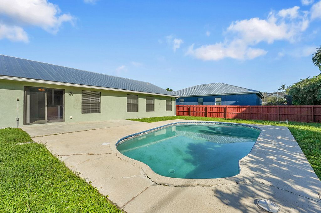 Photo of 2641 SW Eastman Street, Port Saint Lucie, FL 34953 (MLS # R11123948)