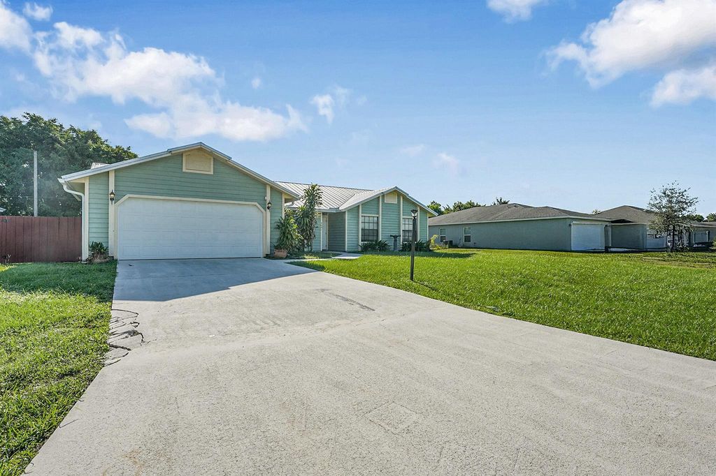 Photo of 2641 SW Eastman Street, Port Saint Lucie, FL 34953 (MLS # R11123948)