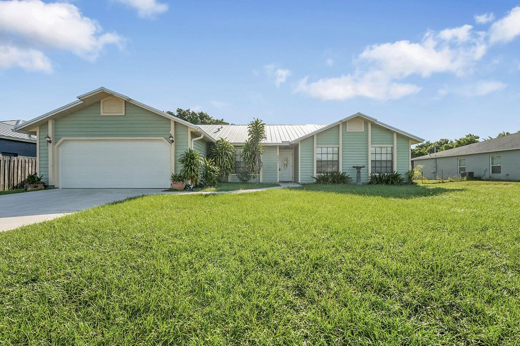 Photo of 2641 SW Eastman Street, Port Saint Lucie, FL 34953 (MLS # R11123948)