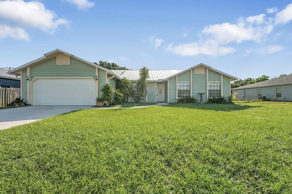 Photo of 2641 SW Eastman Street, Port Saint Lucie, FL 34953 (MLS # R11123948)