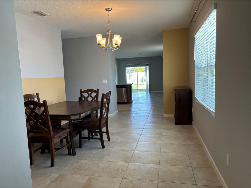 Photo of 11150 SW Sophronia Street, Port Saint Lucie, FL 34987 (MLS # F10424478)