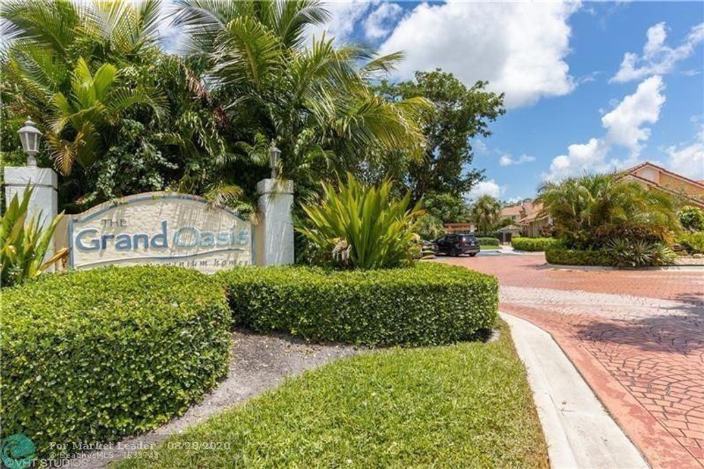 Photo of 5861 Riverside Drive #103, Coral Springs, FL 33067 (MLS # F10556152)