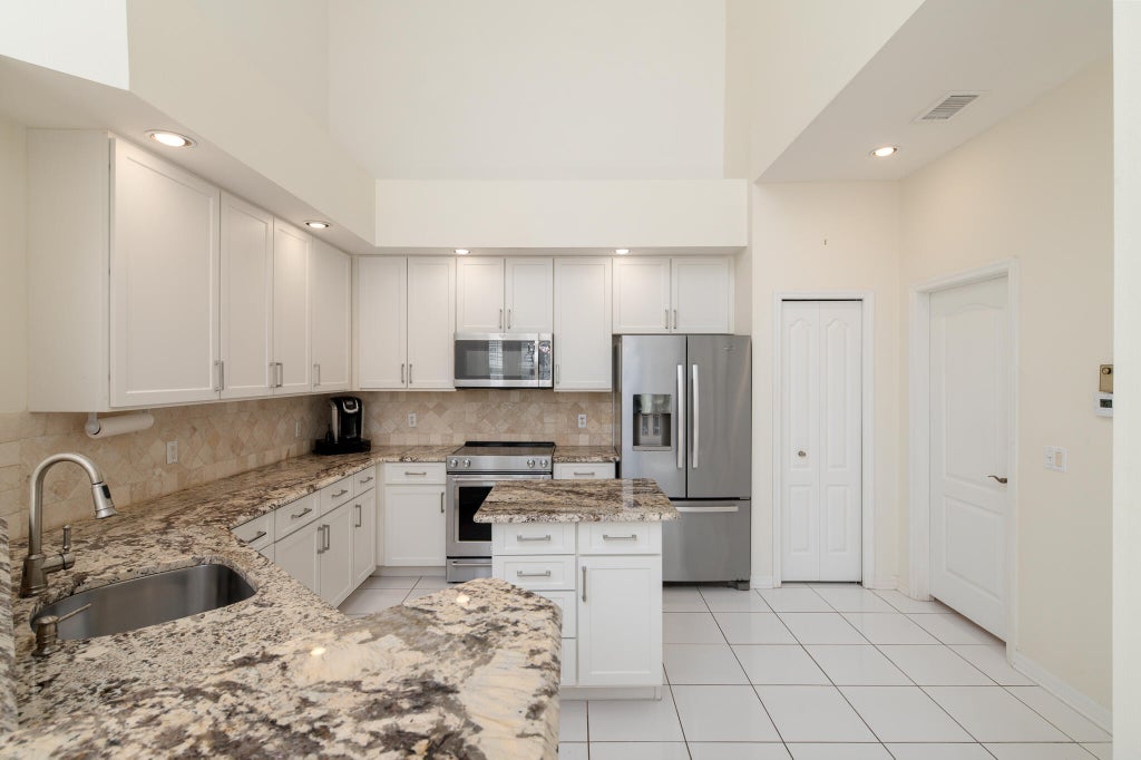 Photo of 1676 SW Harbour Isles Circle #97, Port Saint Lucie, FL 34986 (MLS # B26071593)