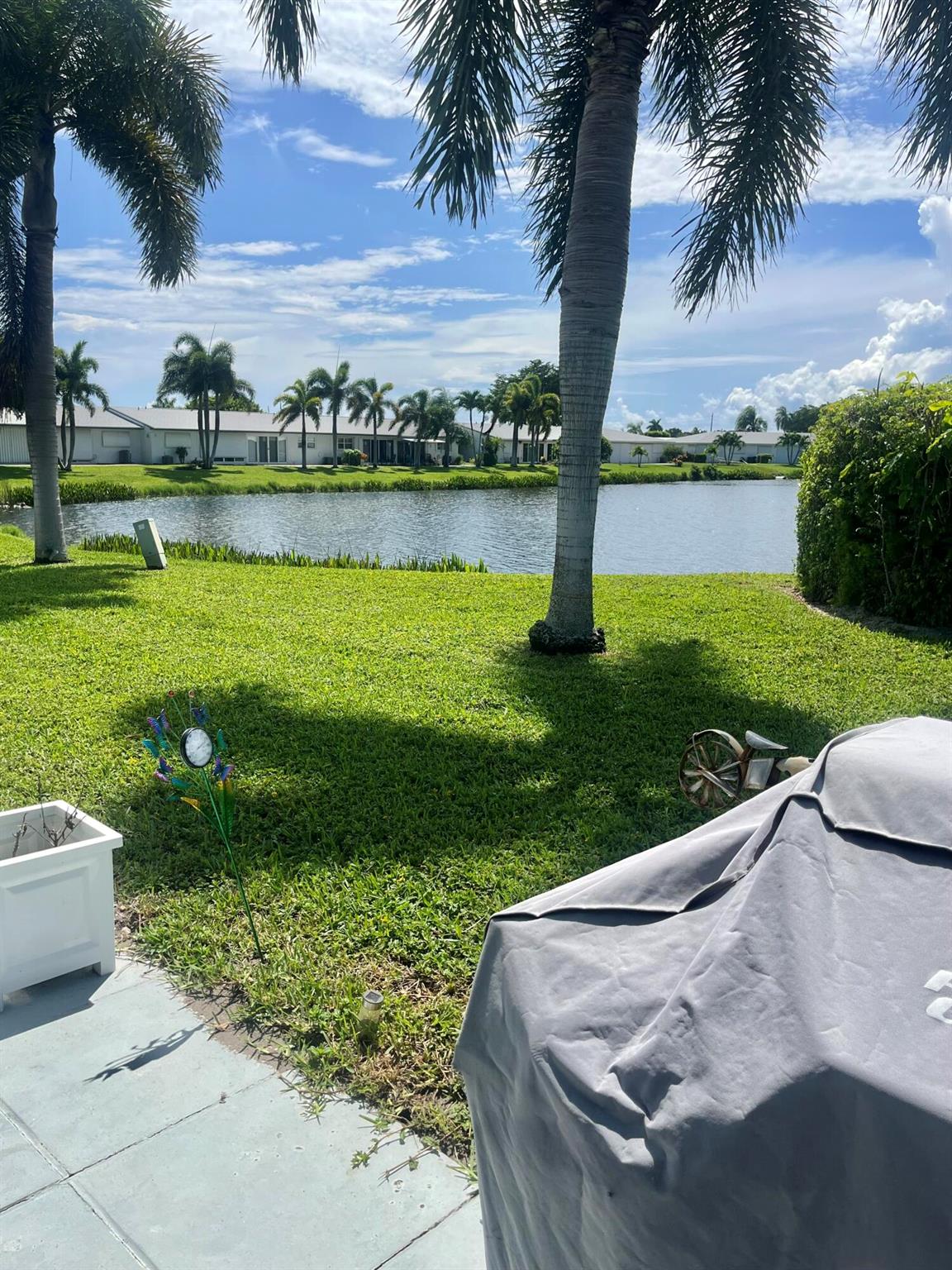 Turn Key just bring your tooth brush to this pride of ownership Villa 2 Bedroom 2 bath Grill on the Back Patio with Lovely Lake view. Laminate Flooring Ideally located walking distance to both R2 & R3 Clubhouses Pools & Fitness center Free 18 hole Golf Minutes to Ocean Beaches Shopping Very Active 55 Community With 3 Clubhouse 3 pools So many amenities great place to call home come take a look!