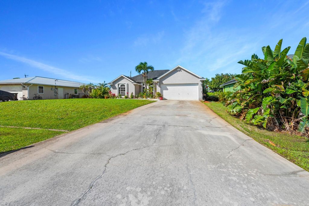 Photo of 1662 SW Victor Lane, Port Saint Lucie, FL 34984 (MLS # R10970354)